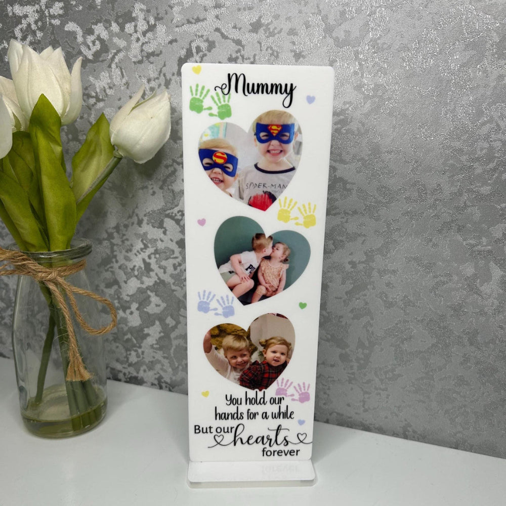 Personalized photo plaque with children's handprints and photos, featuring the word 'Mummy', on a gray textured background.
