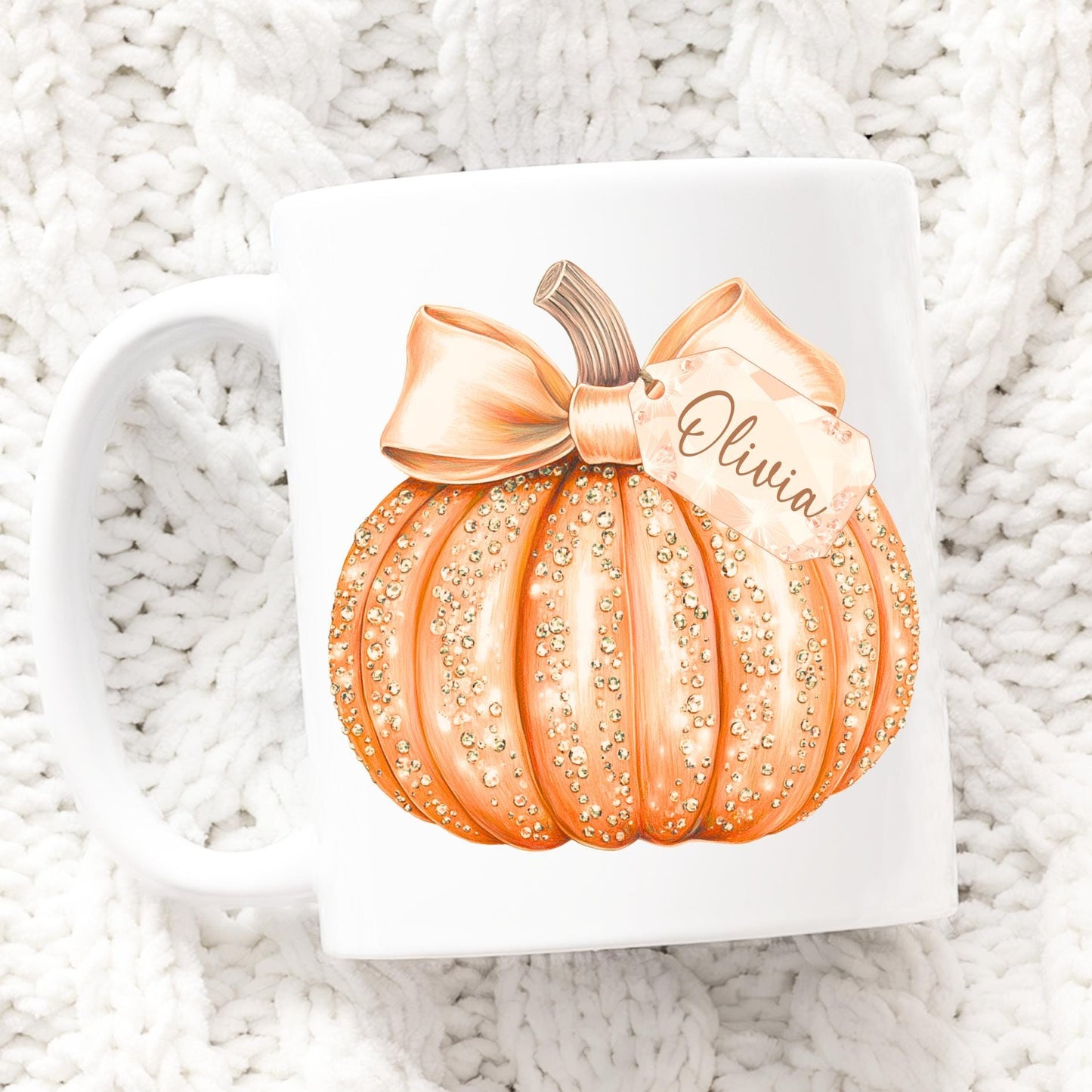 Decorative pumpkin with a bow and 'Olivia' text on a textured white surface