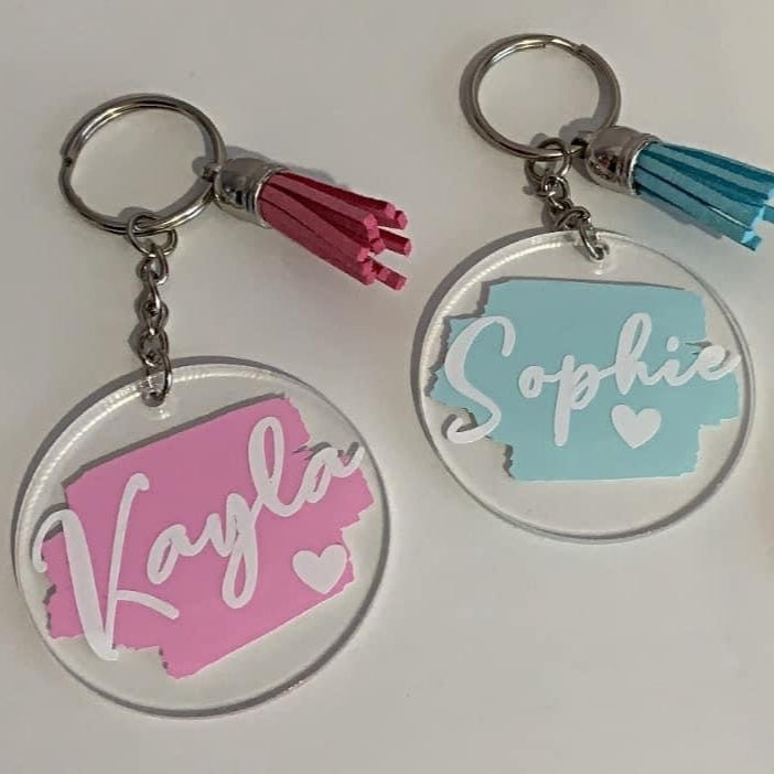 Three keychains with personalized names on a white background, branded 'KBs Crafty Creations'.